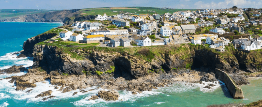 Cornish coastal village, multicoloured houses on the cliffside
