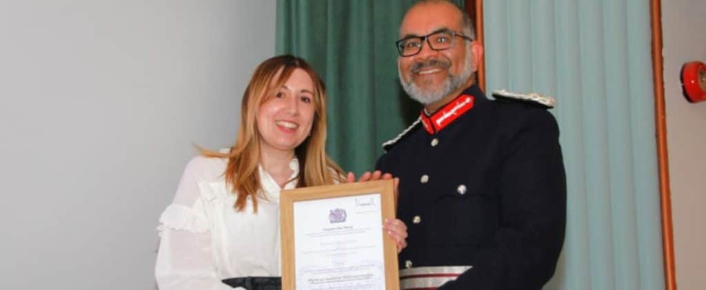 Exmoor Young Voices representative being presented with a certificate