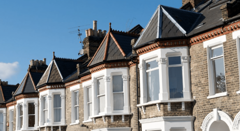 A row of Victorian Terrace housing in the sun to demonstrate the type of home that often struggles with energy efficiency standards.
