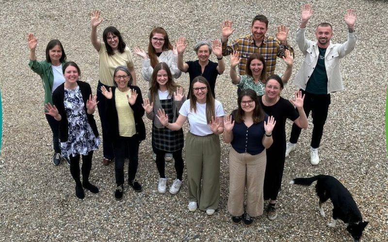 Lendology CIC team waving at camera