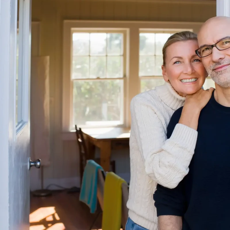 couple-outside-house-2024-10-20-10-22-39-utc